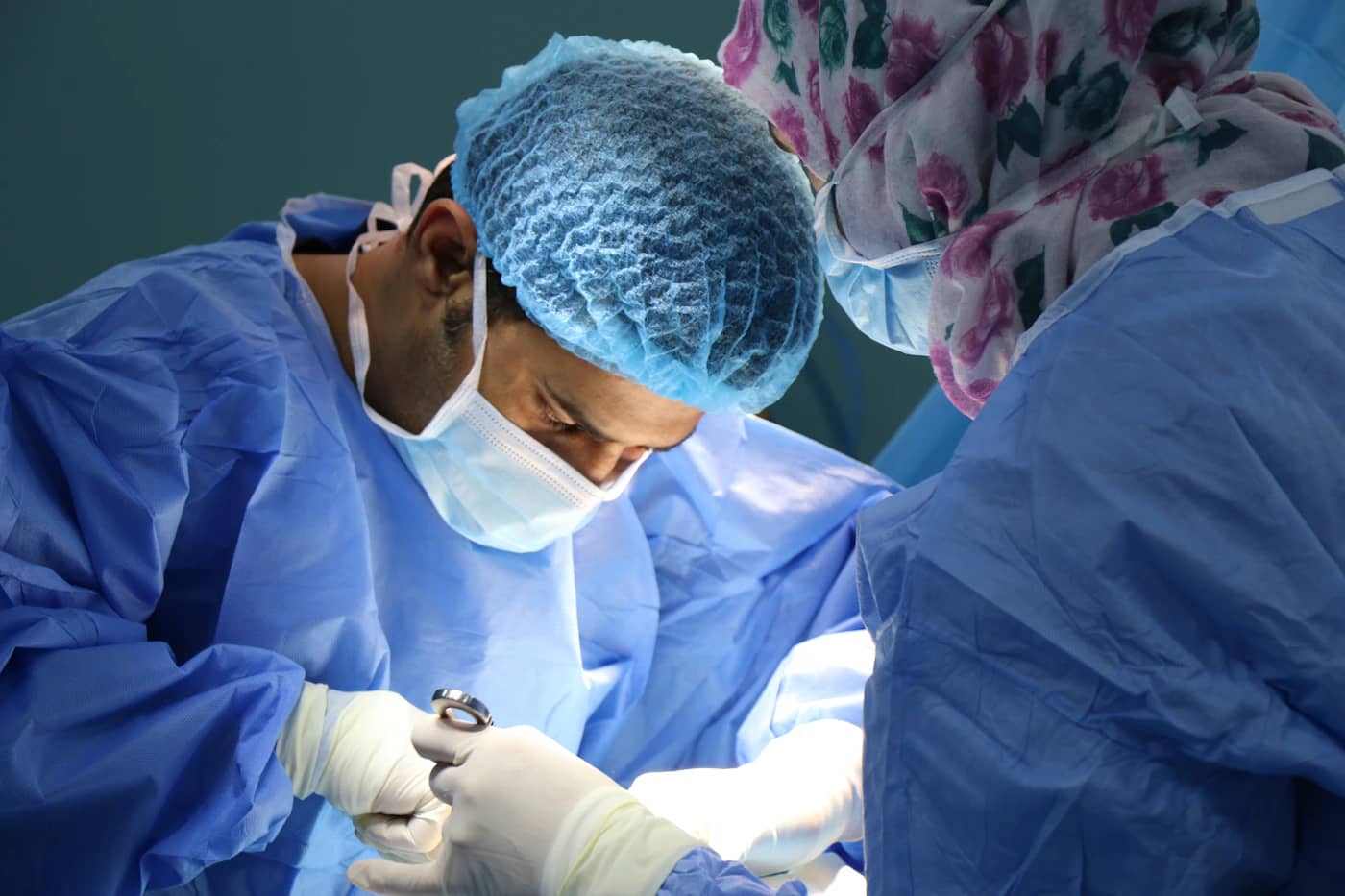 Surgical team preparing for an operation in theatre
